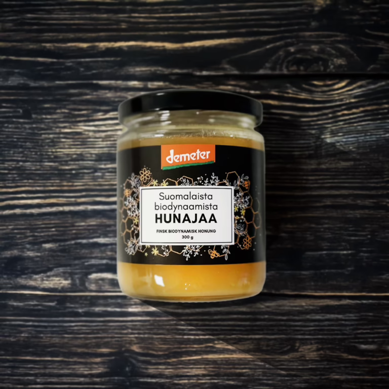 hunaja purkki puisella pöydällä